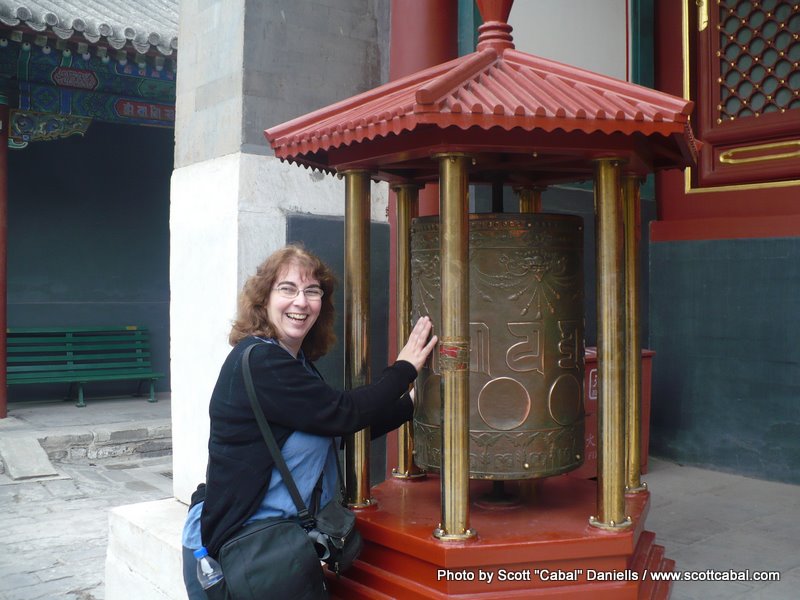 Celia and some prayer wheels at the Lama Temple